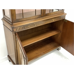 Reproduction mahogany Georgian style display cabinet, projecting dentil cornice above arcade frieze, two astragal glazed doors enclosing adjustable glass shelves, the lower section with leather inset slide and cupboard enclosed by two figured doors, on bracket feet, W115cm, H214cm, D39cm