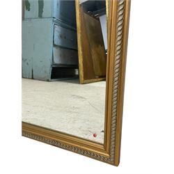 Pair of gilt frame rectangular mirrors, the moulded frame decorated with twist moulding, plain mirror plate 
Provenance: From the Estate of the late Dowager Lady St Oswald