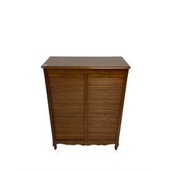 20th century oak filing cabinet, the rectangular top over two tambour front shutters,  opening to reveal series of pull slides, raised on cabriole supports 