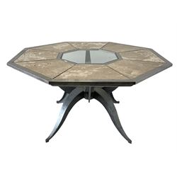 Contemporary steel dining table in octagonal form, with marble and glass inset over one spiralled chrome finial, raised on splayed supports  