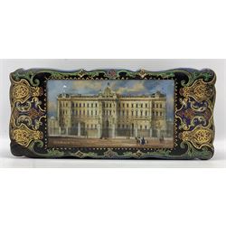Victorian papier-mâché serpentine sewing box, the hinged cover with rectangular coloured and foiled print on glass depicting Buckingham Palace, within a gilt and polychrome decorated border and partly fitted interior, L27cm x H12cm. Provenance: with a hand written letter detailing part of the boxes history, dated 1952
