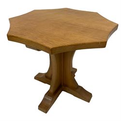 Mouseman - oak coffee table, adzed octagonal top on cruciform base and sledge feet, carved with mouse signature, by the workshop of Robert Thompson, Kilburn