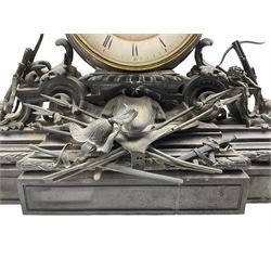 A large and imposing late 19th century French mantle clock with a breakfront plinth constructed from Belgium slate, case adorned with a display of numerous weapons and accruements of medieval warfare, drum movement case housing a large 7” two-part white enamel dial with Roman numerals, minute markers and steel moon hands, visible Brocot deadbeat escapement with cornelian pallets, dial attached to an eight-day rack striking movement striking the hours and half hours on a bell. With Pendulum. 


