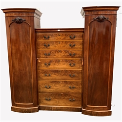 Large Victorian mahogany triple wardrobe, fitted with a bank seven graduated drawers flanked by two full length panelled cupboards with interiors fitted for hanging, W217cm, H218cm, D60cm