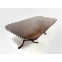 Late 20th century well figured mahogany twin pedestal dining table, the top raised on ring turned pedestals and triple splay supports, with one additional leaf - Manufactured in 1995 by Cumpers of Salisbury, 'Hand made furniture'  243cm x 130cm, H73cm (Extended)