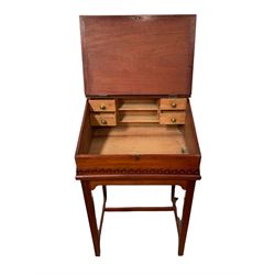 Mahogany school writing slope, the lifting top opening to reveal space with four small drawers, raised on base with square supports W62cm, H103cm, D52cm 