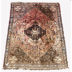  Persian Quashgai red ground rug, decorated with lozenge medallion, stylised foliate and Bucephalus horses, 192cm x 250cm  
