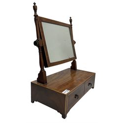 Edwardian mahogany swing mirror, the adjustable mirror supported by two turned uprights over two drawers, raised on bracket supports 