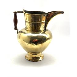19th Century Persian brass water jug with angular spout and turned handle, the collar engraved with flowers H30cm