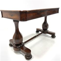 19th century rosewood library table, rectangular top with moulded edge over two frieze drawers, raised on baluster panelled end supports united by turned stretcher, leading to platform bases with compressed bun supports and recessed castors, 66cm x 122cm, H79cm