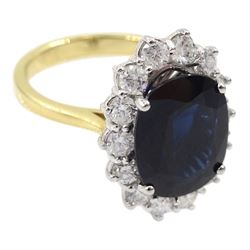 18ct gold oval sapphire and round brilliant cut diamond cluster ring, hallmarked, sapphire approx 5.60 carat, total diamond weight approx 0.80 carat