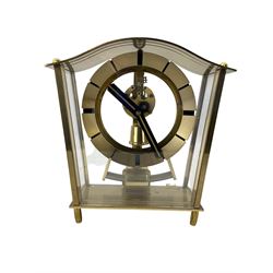 An English early 20th century mahogany 8-day mantle clock with a French timepiece movement and  enamel dial inscribed 