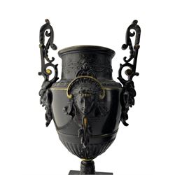 French - Belgium slate mantle clock and garniture c1880, in a breakfront case on a deep stepped plinth, rounded top with recessed carving and decoration, two-part gilt dial with an ivorine and decorative pierced centre, gilt chapter ring with Roman numerals and brass hands, 8-day Parisian movement striking the hours and half-hours on a coiled gong, with conforming urn garnitures. With pendulum. 
Garnitures 38cm high.

