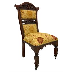 Victorian walnut side chair, shaped cresting rail carved with central cartouche with trailing acanthus leaves, upholstered in red and gold floral pattern fabric, pierced middle rail carved with cartouche and scrolled foliage, reed moulded seat rails, on shaped square supports 