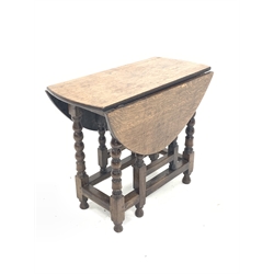 18th century oak gateleg table, the oval top with two drop leaves, over bobbin and block turned supports 