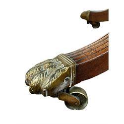 George III mahogany breakfast or dining table, moulded oval tilt-top with brass catch, on ring turned vasiform pedestal with four splayed reeded supports, on cast brass hairy paw castors