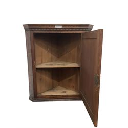 Georgian style oak wall hanging corner cupboard, fitted with single panelled door