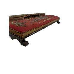 Victorian long footstool, with red floral upholstery over ebonised frame, together with another long footstool 