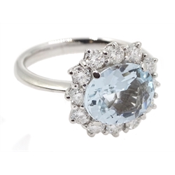  18ct white gold oval aquamarine and diamond cluster ring, hallmarked, aquamarine approx 2.20 carat, diamond total weight approx 0.70 carat  