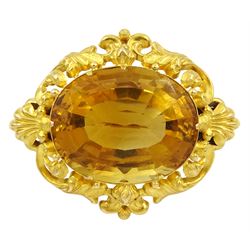 Victorian gold scroll and pierced design brooch, set with an oval citrine