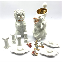 Various bisque Christmas cake decorations including Santa Claus, two figures skiing, winged Cherubs etc together with a Heubach Maltese Terrier and similar German Bear moulded jug H27cm 