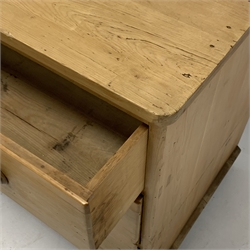  20th century pine chest of three deep drawers, with turned pull handles and bun supports, W98cm, H87cm, D62cm  