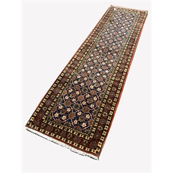 Persian Veramin ground runner rug, with repeating floral decoration enclosed by multi line border, 287cm x 80cm