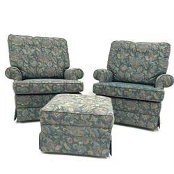 Parker Knoll - Pair of armchairs upholstered in blue floral fabric, and raised on castors, W87cm with matching footstool