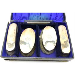 Pair of silver backed hair brushes matching clothes brushes and comb each engraved with a monogram and in fitted case Birmingham 1914 Maker William Adams 