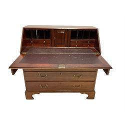 George III mahogany bureau, the fall front opening to reveal interior with drawers, cupboards and pigeon holes over four graduated drawers, raised on bracket supports W 107cm, H109cm, D56cm 