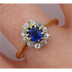 Gold oval synthetic sapphire and diamond cluster ring, stamped 18ct