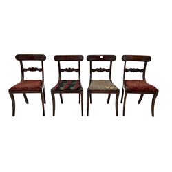 Set four Regency mahogany dining chairs, the carved cresting rail and back rail over drop in seat pad, raised on sabre supports 