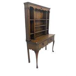 18th century country oak dresser, projecting cornice over shaped and pierced apron and three open shelves, two drawers to base, raised on cabriole supports W126cm, H186cm, D45cm