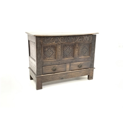 18th century mule chest, plain hinged lid with moulded edge above scroll carved frieze and three carved and fielded panels, two drawers under, on stile supports W128cm