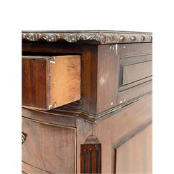 Georgian style mahogany twin pedestal partner's desk, shaped top with inset leather and gadroon moulded edge, each side fitted with nine drawers, panelled sides, on shaped bracket feet carved with foliage