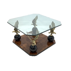 Hollywood Regency coffee table, bevelled glass top raised on four solid gilt brass eagles on a polished burr walnut veneered base 