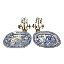 Pair of brass two branch candelabra with prism drops H30cm together with two Willow pattern meat plates (4)