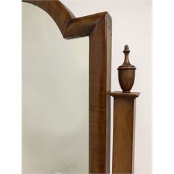 Georgian style walnut cheval dressing mirror, the swing mirror with stepped arched top on square tapered uprights with urn finials, four splayed supports with castors 