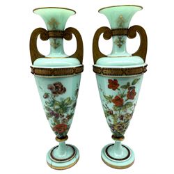 Pair of 19th century opague glass urn form vases, with gilded and jewelled banding, floral painted bodies and scroll form handles, one a/f H46.5cm 