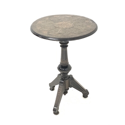 Late 19th century Anglo-Indian ebonised occasional table, the circular moulded top with brass and copper floral filigree inlay centred by medallion, raised on turned column and three scroll carved splayed supports with turned feet 