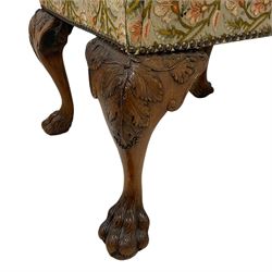 George II design walnut cabriole stool, rectangular seat upholstered in Indian silk and metal thread floral crewel work with studded band, hairy paw carved cabriole supports with fruiting vine leaf and scroll carved knees
Provenance: From the Estate of the late Dowager Lady St Oswald