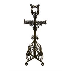Late 19th century Aesthetic Movement ornate brass standard lamp, the top with scrolling acanthus leaves, the central rosewood table with pierced scroll gallery, raised on a turned column with x-base on scroll feet