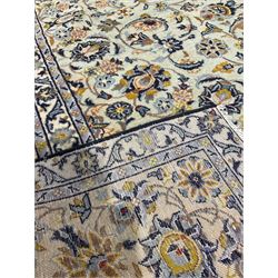 Persian design ivory rug, with overall floral design 