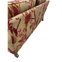 Duresta - two seat sofa upholstered in embossed floral fabric with footstool 