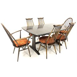 Ercol rectangular dark elm extending dining table, shaped supports united by stretchers (L156cm/253cm, W102cm, H74cm), together with set of six (2+4) Ercol chairs, (W66cm)