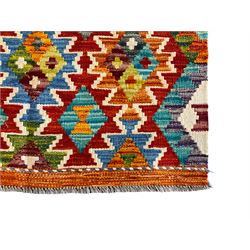 Chobi Kilim multi-colour rug, the field decorated with all-over geometric lozenges with ivory outlines, the long edges with amber outer bands