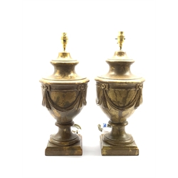 Pair of modern pottery table lamps, of urn form, relief moulded with gilt swags against a gilt ground, H44cm 
