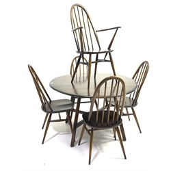 Ercol dark elm drop leaf dining table,  oval top raised on four moulded and splayed square supports united by 'X' stretcher, together with a set of five (4+1) Ercol dining chairs chair 
