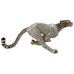 Herend model of a large running Cheetah, the body painted in a butterscotch and black fishnet scale pattern, inscribed no. 15656, painted 15656-0-00/VHSP32, H15.5cm x L37cm