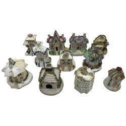 19th century pastille burners and money boxes modelled as cottages and castles, three Coalport pastille burners comprising 'The Villa', 'The Summer House' and 'The Toll House', various 19th century and later fairings, pair of Staffordshire poodles etc. Provenance: From the Estate of the late Dowager Lady St Oswald